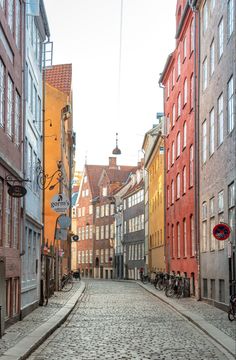 an empty cobblestone street in the old part of town