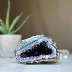 This deep purple amethyst geode cave has the highest quality of the semi precious stones. This geode has beautiful large crystals and agate bands. Combine design and wellness by adding an amethyst geode to the decoration of your spaces. Its vibrant deep purple color is characteristic of the geodes extracted from URUGUAY, one of the few places in the world where you can find. YOU WILL RECEIVE THE PIECE OF THE PICTURE!! ✧ MEASURES: Height: 2.5 in. x Width: 4 in. Weight 1.6 lb (765 gr). ✧     Our gemstones was packaged one by one very carefully in a PREMIUM RIGID GIFT BOX with cushioned interior protection that protects it from any impact, (do not risk buying stones wrapped in just a paper). The premium gift box allows you to give it as a jewelry piece. ✧     The back and base of these amethy Large Agate Geode For Spiritual Purposes, Large Agate Geode For Spiritual Use, Healing Gemstone Geodes, Unique Healing Gemstone Geodes, Unique Healing Geodes, Unique Geodes For Healing, Spiritual Healing Gemstone Geodes, Large Spiritual Geodes For Healing, Healing Agate Geode Gemstones