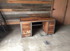 a desk made out of wood with drawers