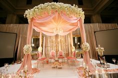 an elegant wedding setup with pink and white flowers