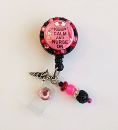 Badge reel This cute badge reel is handmade and comes with a very cute charm and dangling beads as shown in the pic. Show off your new handmade badge reel to all your co-workers All badge reels come on a slide clip! Alligator swivel clip upon request Novelty Pink Badge Reel, Fun Pink Badge Reel For Gift, Pink Badge Reel With Swivel Clip As Gift, Fun Pink Badge Holders For Gift, Customizable Adjustable Pink Badge Holders, Novelty Adjustable Badge Holders For Gift, Novelty Adjustable Badge Holders For Gifts, Personalized Pink Badge Reel For Birthday, Handmade Novelty Pink Badge Reel