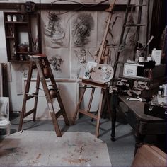 an artist's studio with several wooden ladders