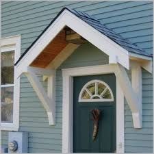 a blue house with a green door and white trim