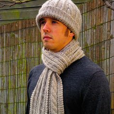 a man wearing a knitted hat and scarf