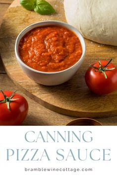 a bowl of pizza sauce next to tomatoes on a cutting board with the words canning pizza sauce