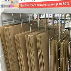 there is a sign that says congratulations sale in front of many stacks of folders