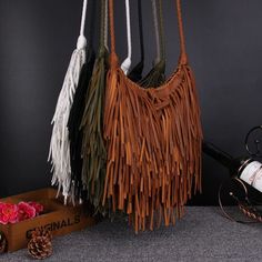 An impressive, versatile, and stylish bag. The unique Nefeli Fringe Crossbody Bag its been a street-style favorite. This style works well with both dressy and casual outfits, will always look current, and is comfortable to carry around. Specs: Size: 21x18x6cm/ 8.26'' x 7.08'' x 2.36'' Material: PU Cell Phone Pocket Interior Zipper Pocket Fringe Handbags, Fringe Crossbody Bag, Popular Handbags, Fringe Purse, Woven Handbags, Unique Purses, Boho Purses, Fringe Bags, Handbags Affordable