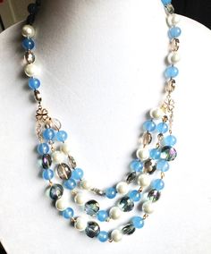 Handmade beaded Blue crystal necklace, pearl and crystal necklace, statement blue pearl necklace, multi strand and one of a kind necklace Blue Pearl Necklaces With Polished Beads, Blue Pearl Beaded Necklace With Polished Beads, Blue Pearl Necklace With Polished Beads, Blue Pearl Jewelry With Colorful Beads, Elegant Blue Pearl Necklace With Colorful Beads, Elegant Light Blue Beaded Chain Necklaces, Elegant Light Blue Beaded Chain Necklace, Blue Pearl Jewelry With Polished Beads, Blue Pearl Necklace With Colorful Beads