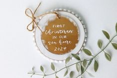 a ceramic ornament with the words first united in our new home on it