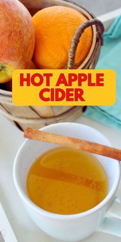 there is a bowl of apple cider next to an orange and cinnamon stick with the words hot apple cider on it