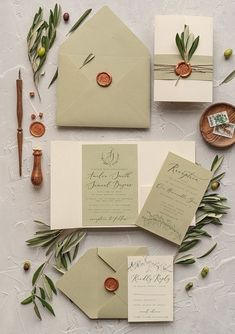 the wedding stationery is laid out and ready to be put into their guests'envelopes