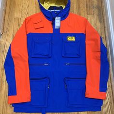 Ralph Lauren Polo High Tech Royal Blue And Orange Jacket Size Large New With Tags And Even The Zipper Is Wrapped And Great Details And Quality Functional Orange Long Sleeve Outerwear, Functional Orange Outerwear For Fall, Blue Outerwear With Patch Pockets For Outdoor, Orange Outerwear With Pockets For Outdoor, Orange Outdoor Outerwear With Pockets, Functional Blue Outerwear For Work, Blue Functional Outerwear For Work, Orange Long Sleeve Color Block Outerwear, Casual Orange Color Block Outerwear