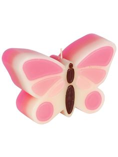 a pink and white butterfly shaped candle