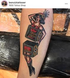 a person with a tattoo on their arm and leg is wearing a costume that has been made to look like a woman's legs