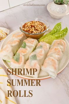 shrimp summer rolls on a plate with dipping sauce