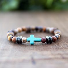 "Unisex Cross Bracelet Natural Wood and Gemstone Beads Stretch Style, Religious Beaded Christian Sideways Cross Bracelet, Spiritual Gift Idea for any religious event! I made these Rustic Cross Bracelet with Coconut Wood and 6mm AA Gemstone Beads Blue Howlite Cross, on Jewelers Stretch Cord. ☽SHIPS USPS SAME DAY AS ORDER You're Welcome!! =) ☮Buy with confidence, I have a 100% positive feedback score, \"if you're happy, I'm happy\"! REALLY! ☽Always Packed Safely in a Gift Box ready for gift giving Brown Cross Bracelet Spiritual Style, Spiritual Brown Cross Bracelet, Mens Cross Bracelet, Beachy Bracelets, Wave Jewelry, Rustic Cross, Blue Howlite, Coconut Wood, Wood Bead Bracelet