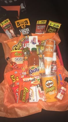 an orange bag filled with snacks and drinks