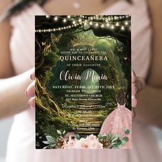 a woman in a pink dress holding up a card with the words quincaanera on it