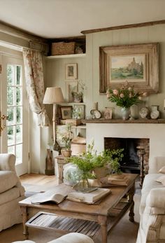 a living room filled with furniture and a fire place in front of a painting on the wall