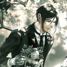 a man in a tuxedo holding a bouquet of flowers next to a tree