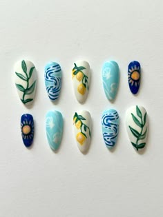 Summer vacation in a nail set! Hello! Thank you for visiting my new up and running shop! My name is Taylor and I've been making press-ons for a while now, and finally decided to start selling them! I do custom orders, as well as pre-made nail sets and hope to give you amazing nails! Enjoy shopping:) Choose your size and nail shape Press on nails last up to 10-14 days and won't damage your nails! All sets include:  - Press-on nail set - Nail sticky tabs - Nail glue - Cuticle stick - Nail Buffer - Light Blue Nails With Sunflower, Mexico Inspired Nails Art Designs, Nails With Oranges, Nails With Sun Design, Mismatched Nails Summer, Summer Nails With Charms, Outdoorsy Nails, Sardine Nails, Fun Summer Nails Short