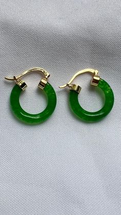 Dark green Jade earrings, Green Jade hoop earrings, Green hoop earrings, Gemstone earrings for women, gold filled earrings, Statement Earrings  These Unique and Trendy Dark Green Jade 18 Kt gold filled hoop earrings are definitely an eye candy to step up your outfit, can be worn for any event or special occasion. The ideal gift for you , mom, daughter, girlfriend, wife or special someone.  Material  . 18 Kt Gold Filled  . Brass  . Jade Gemstone  Size  . 1" inches  length ( approximately)  Thank you so much for taking your time to check my Shop . Follow me on instagram @jewelrybyana for more trending accessories ideas. Green Tarnish-resistant Huggie Jewelry, Elegant Green Dangle Huggie Earrings, Elegant Green Hoop Earrings Pierced, Elegant Green Huggie Jewelry, Elegant Green Pierced Hoop Earrings, May Birthstone Round Hoop Earrings For Pierced Ears, May Birthstone Round Hoop Earrings, Green Tarnish Resistant Hoop Earrings For Gift, Green Small Hoop Earrings Tarnish Resistant