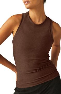 Move from the yoga studio to running errands in ultimate comfort in this superstretchy tank boasting a sporty racerback and subtly ruched seams. 21" length (size Medium) Crewneck Racerback 94% polyester, 6% elastane Machine wash, tumble dry Made in the USA of imported fabric Brown Fitted Sleeveless Activewear, Sporty Brown Stretch Top, Sporty Stretch Brown Tops, Brown Stretch Athleisure Top, Brown Sleeveless Athleisure Activewear, Brown Stretch Workout Top, Sporty Brown Gym Tops, Sporty Brown Tops For Gym, Sporty Brown Tops For The Gym