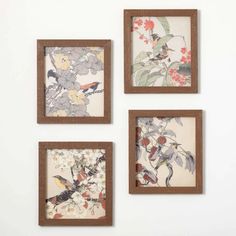 three framed pictures hanging on the wall with flowers and birds in them, one has a brown frame