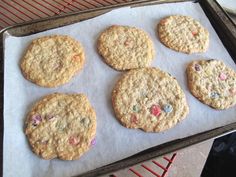 six cookies sitting on top of a baking sheet