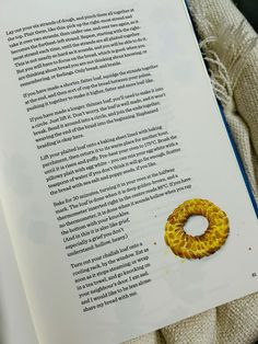 an open book with a yellow ring on it