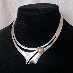 Absolutely Stunning Vintage Sterling Silver Taxco Mexican Alicia De La Paz Faux Pearl Collar Necklace. Such A Statement - Modernist/Brutalist Piece With A Opalescent, Off White Faux Pearl Set In Brass. Very High Quality And A Solid Piece. Stamped Mexico Td-27 Alicia 950 (Actually Higher Quality Than Sterling, Which Is 925), The Circumference Is About 14.5 Inches, Drop Length 1.25 Inches, 96.9g. Spl Luxury Modernist Necklace With Large Pendant, Modernist Metal Necklace With Polished Finish, Taxco Silver Jewelry Vintage, Modernist Polished Silver Necklaces, Collectible Modernist Pendant Necklace, Pearl Set, Collar Necklace, Vintage Sterling Silver, Faux Pearl