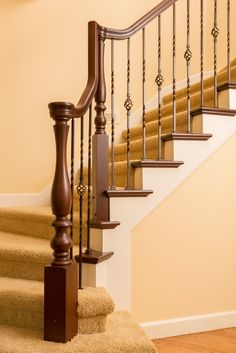 the stairs are made of wood and have handrails