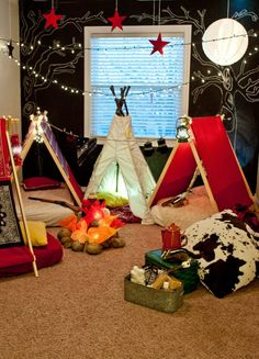 a room with several teepees and other items on the floor