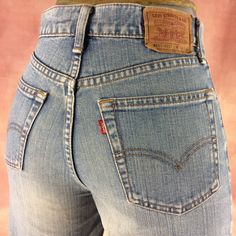 "Size 26 Vintage 1990s Levi's 557 Bootcut Jeans - W26 L30 - Wide Leg Flare Jeans - High Waisted - Made in Japan, waist 26\" Small Brand: LEVIS W557 Size On Tag marked W29 L32 but fits more like 26\" waist, 12.5\" rise, 23\" thighs, 39\" hips, 30.5\" inseam, 17\" knee, 19\" leg opening! Fits a size 26, but check your measurements and compare the measurement with your garment. (see full measurement below) Recommended waist size: 26\" (26x30.5) Material :  Cotton 100% Single felled inseam Made In J 90s Fitted Bottoms With Pockets, 90s Style Bottoms With Straight Leg And Belt Loops, 90s Style Fitted Medium Wash Bottoms, 90s Style Fitted Straight Leg Bottoms, 90s Fitted Straight Leg Bottoms, 90s Style Fitted High Rise Pants, Vintage Fitted Short Bottoms, 90s Fitted Bottoms With Belt Loops, Vintage Mid-rise Bottoms With Belt Loops