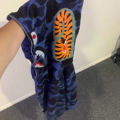 Amazing Condition Pretty Much Brand New. 100% Authentic. Dark Blue/Navy Blue Bape Shark Zip Up Hoodie. Bape Shark Slp, Shark Zip Up Hoodie, Blue Bape Hoodie, Bape Jacket, Bape Shark, Bape Hoodie, Shark Hoodie, Red Camo, Camo Hoodie