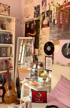 a room filled with lots of books and musical instruments