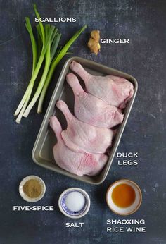 raw chicken in a pan with ingredients to make it