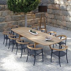 an outdoor dining table with chairs around it