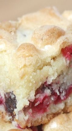 a close up of some food on a white plate with blueberries and raspberry