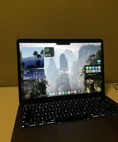 an open laptop computer sitting on top of a desk