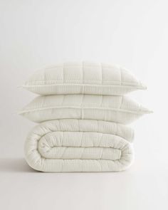 three pillows stacked on top of each other