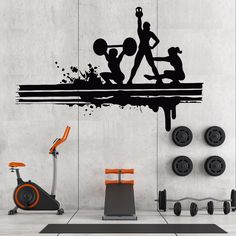 an exercise room with wall stickers depicting people doing different things