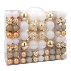 a clear box filled with gold and white ornaments