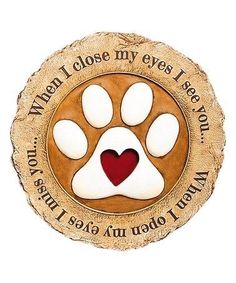 a dog's paw with a red heart on it and the words when i close my eyes i see you