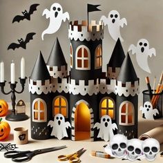 a halloween castle made out of paper with skulls and bats on it, surrounded by other decorations