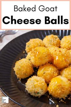 baked goat cheese balls on a black plate with text overlay that reads baked goat cheese balls