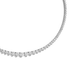 Designed with comfort in mind, the 18 Carat Graduated Tennis Necklace is handmade to be fluid, not rigid, allowing it movement for comfortable wear. It features prong-set brilliant round diamonds ascending in size as it reaches the center of the necklace. Classic Necklace With Round Cut Diamond Accents, Classic Diamond White Necklace With 17 Jewels, Classic Platinum Necklace With Prong Setting, Classic Solitaire Necklace With 17 Jewels In Platinum, Classic Platinum Tennis Necklace With Prong Setting, Classic Platinum Solitaire Necklace With 17 Jewels, Timeless Platinum Necklace With Prong Setting, Classic Necklaces With Single Cut Round Diamonds, Classic Round Cut Prong Set Necklace