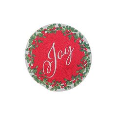 a red and green christmas ornament with the word joy written in white lettering