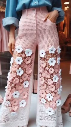 a mannequin wearing pink pants with flowers on them