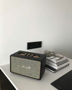 a radio sitting on top of a white table